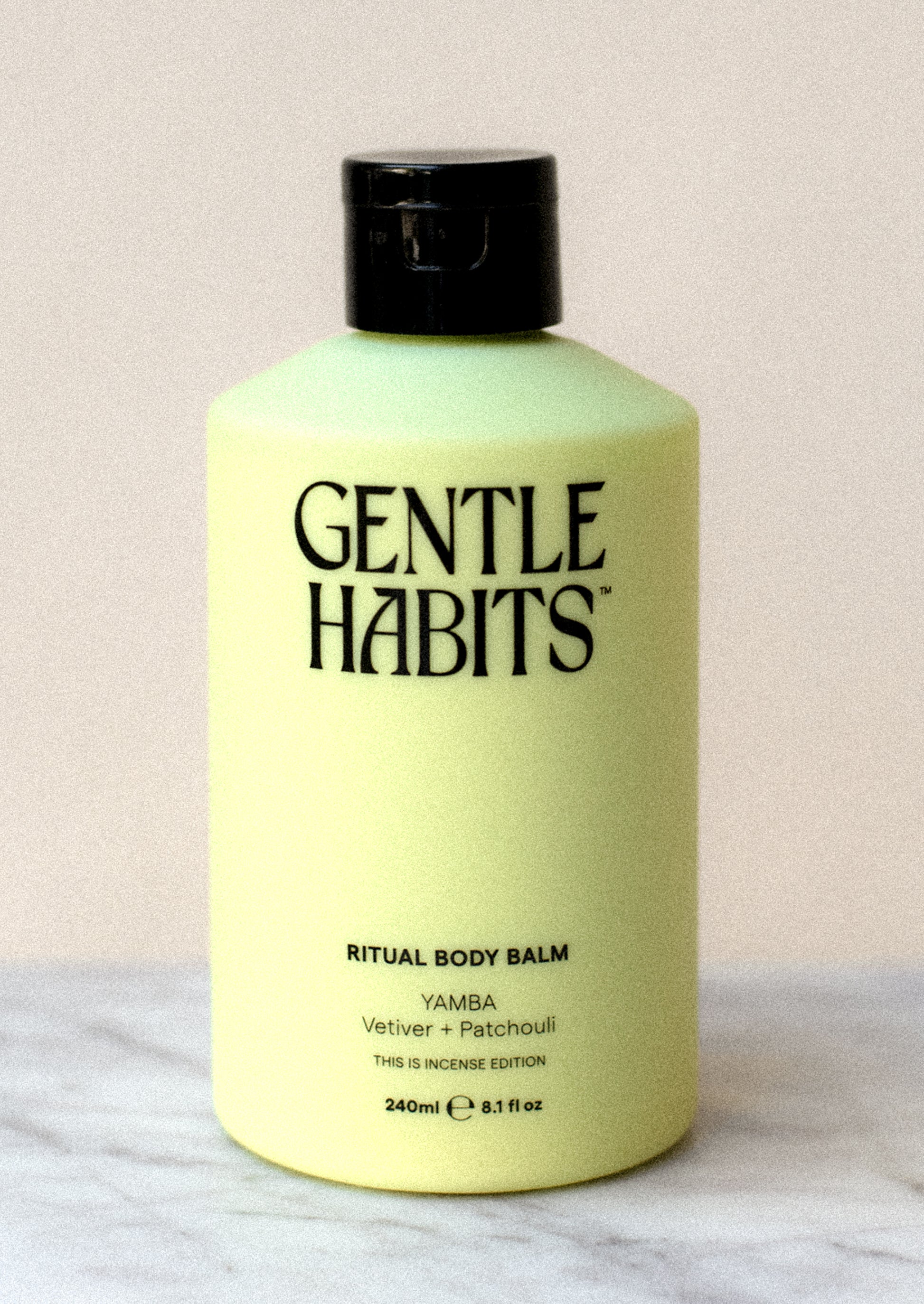 A bottle of body lotion in green.