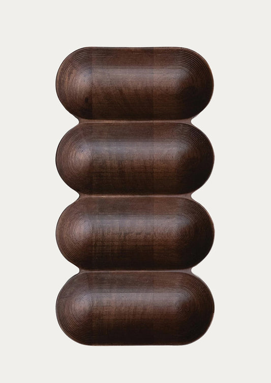 A dark wood serving vessel with four sections.
