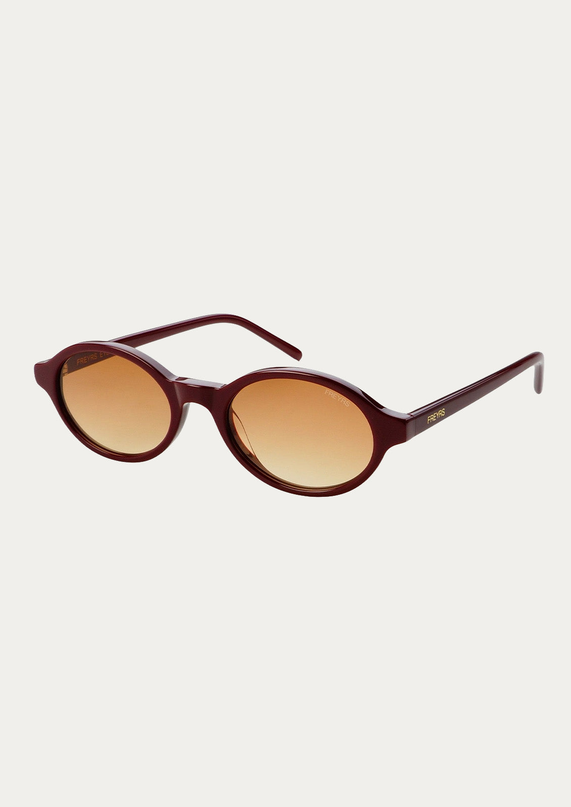A pair of round oval sunglasses with a burgundy frame and light brown tinted lenses.