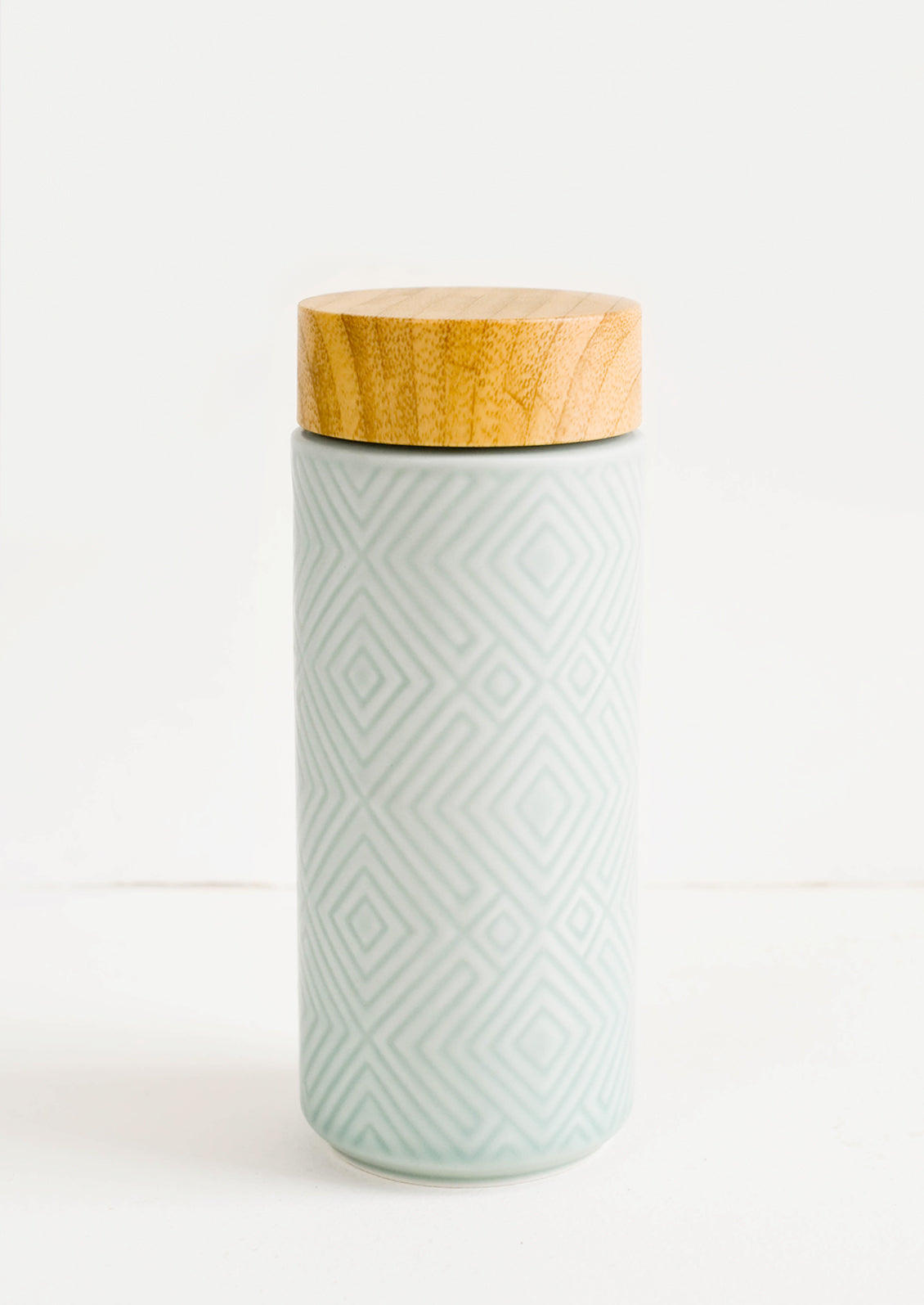 Geometric textured ceramic tall travel tumbler in mint color with bamboo lid