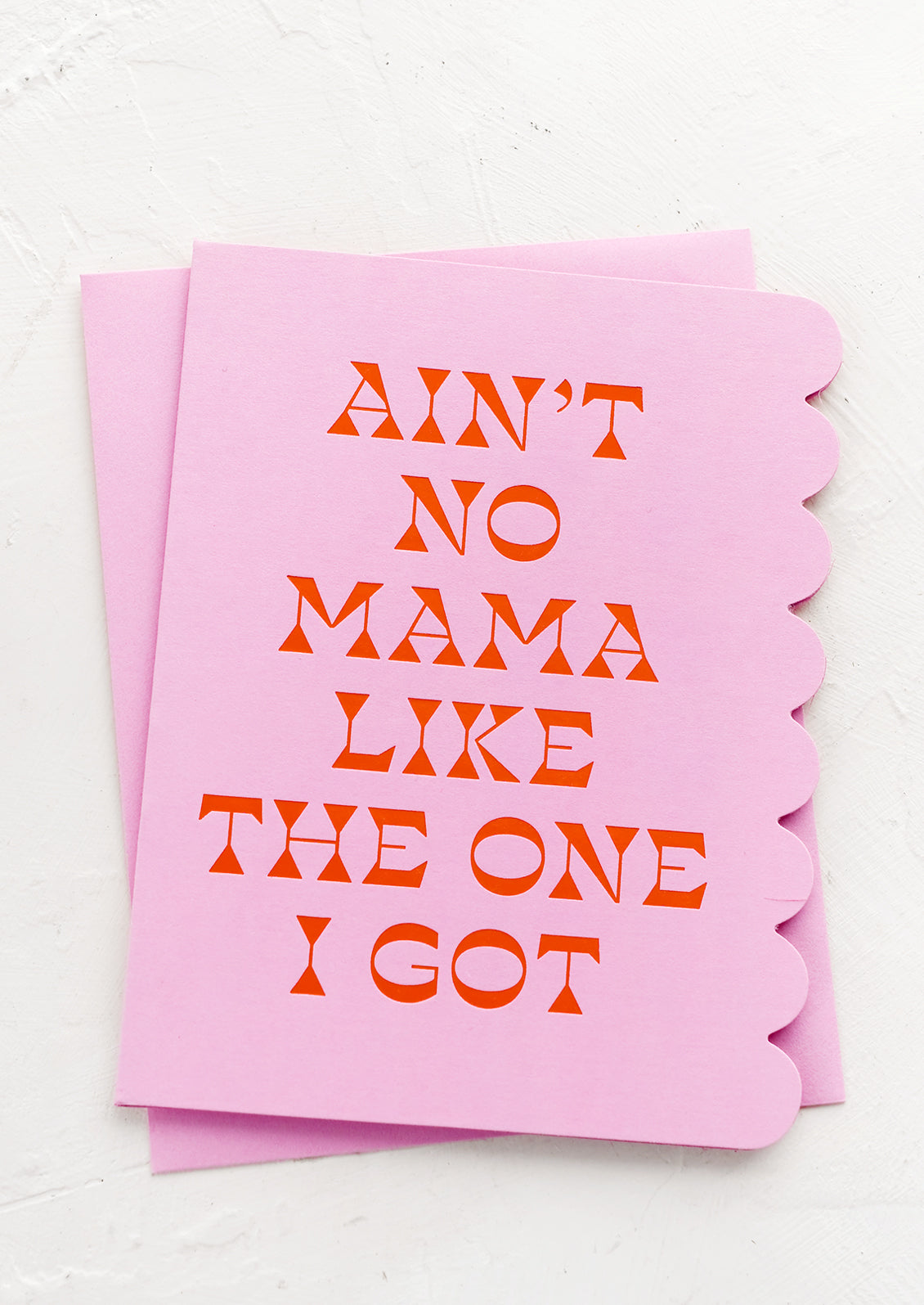 A greeting card reading "Ain't No Mama Like The One I Got".