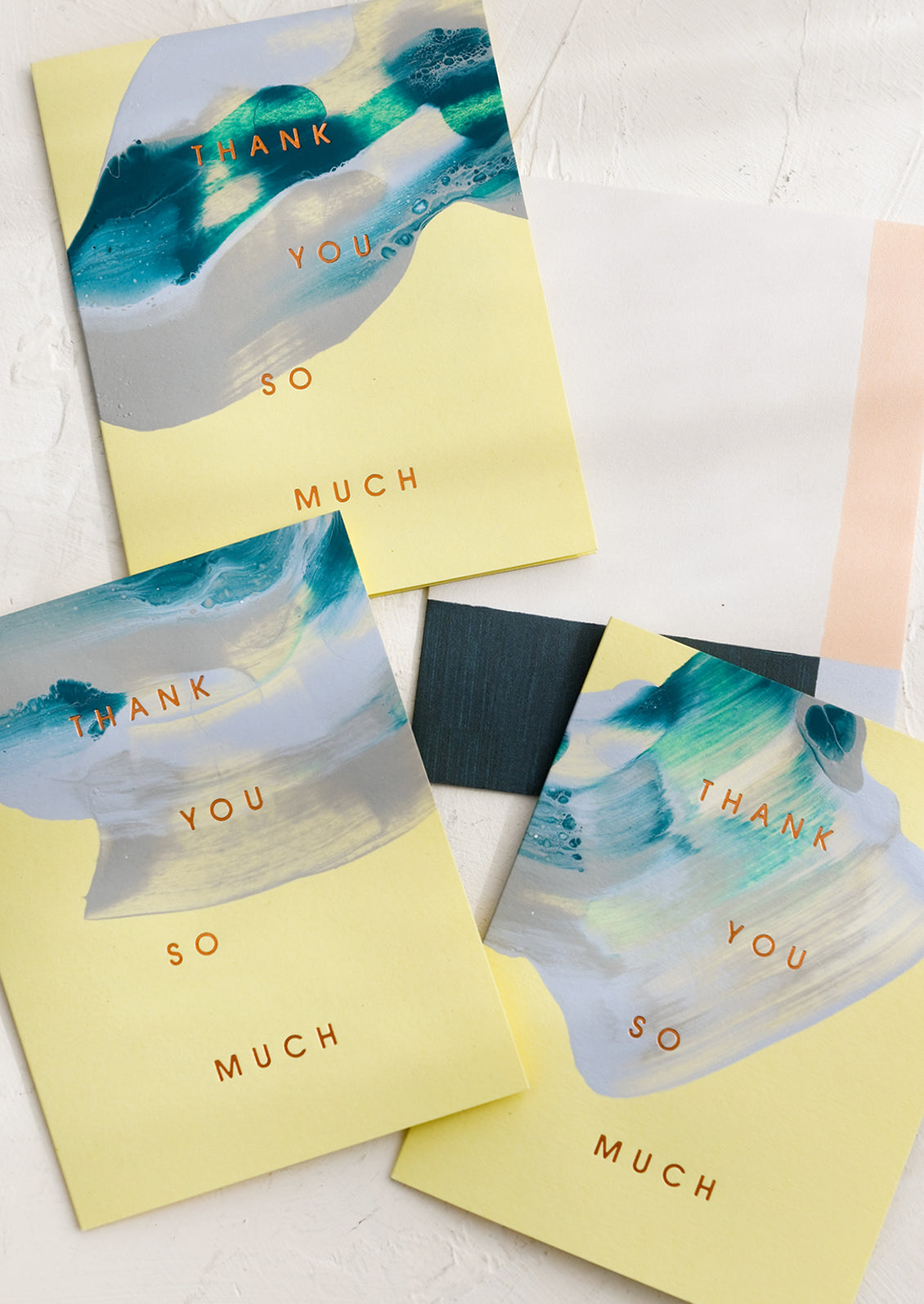 A set of lime green and blue swirl thank you cards.