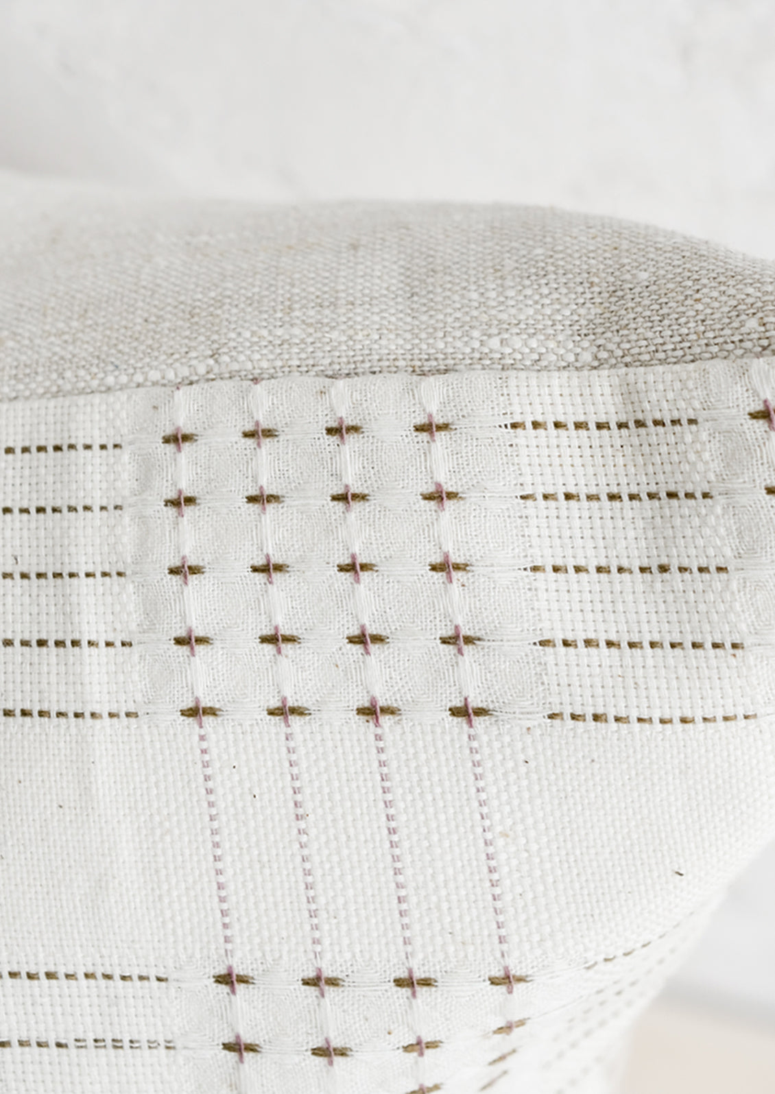 Embroidered basketweave pattern in brown.