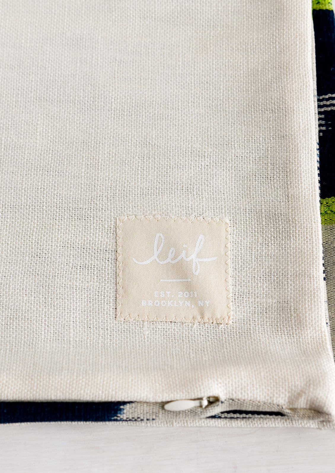 Logo patch on pillow.