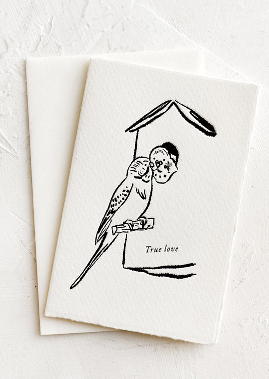 A card with image of budgie birds, text reads "True love".
