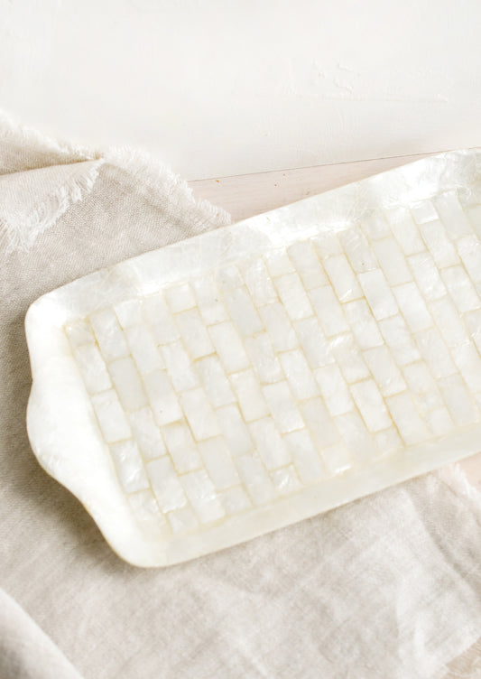 A rectangular catchall tray made from tiled capiz shell.