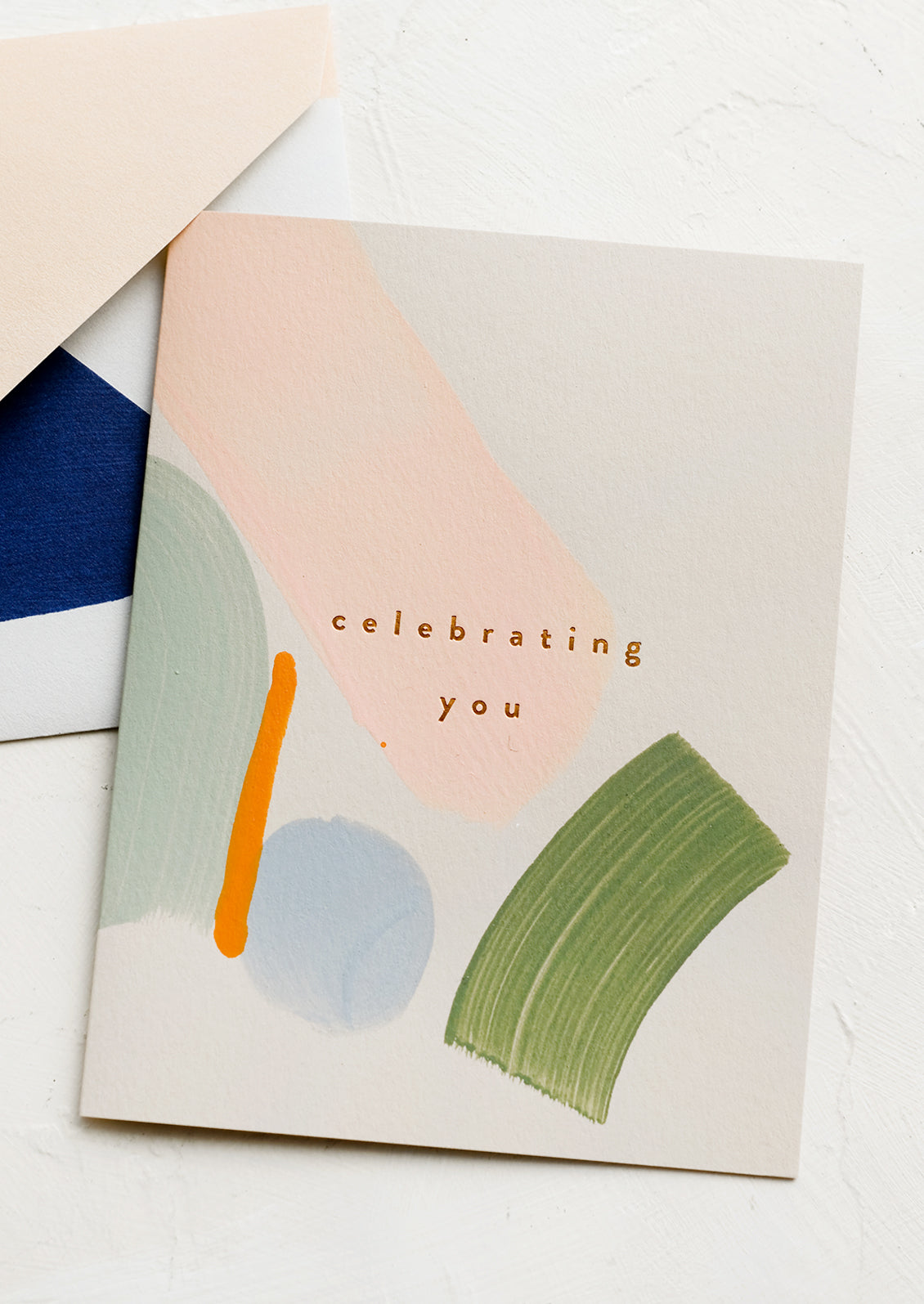 A card with text reading "celebrating you".
