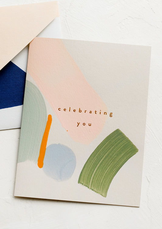 A card with text reading "celebrating you".