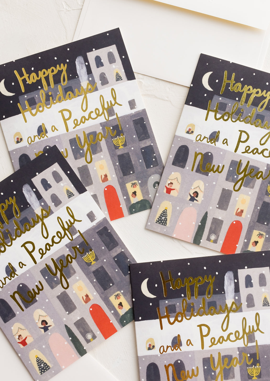 An illustrated greeting card set featuring apartment building with window scenes.