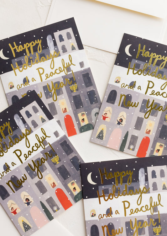 An illustrated greeting card set featuring apartment building with window scenes.