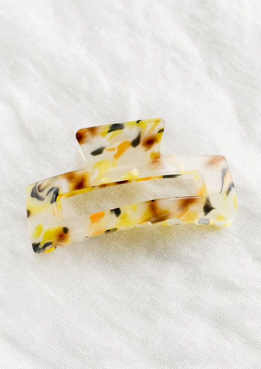 A color fleck hair claw in yellow multi.