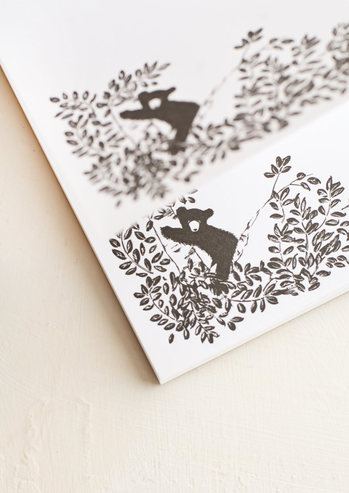 A letterpress printed notepad showing individually printed pages.