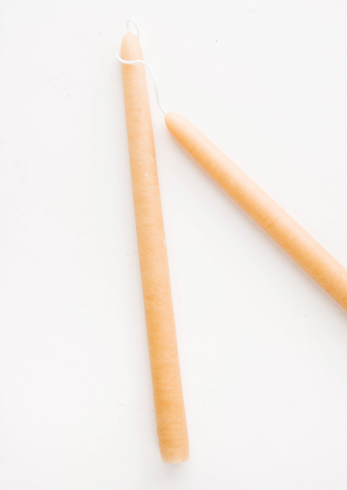 Pair of taper candles in parchment tan