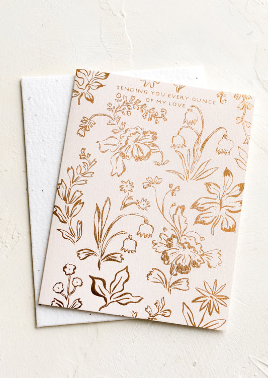 A floral print greeting card with text reading "Sending you every ounce of my love" card.