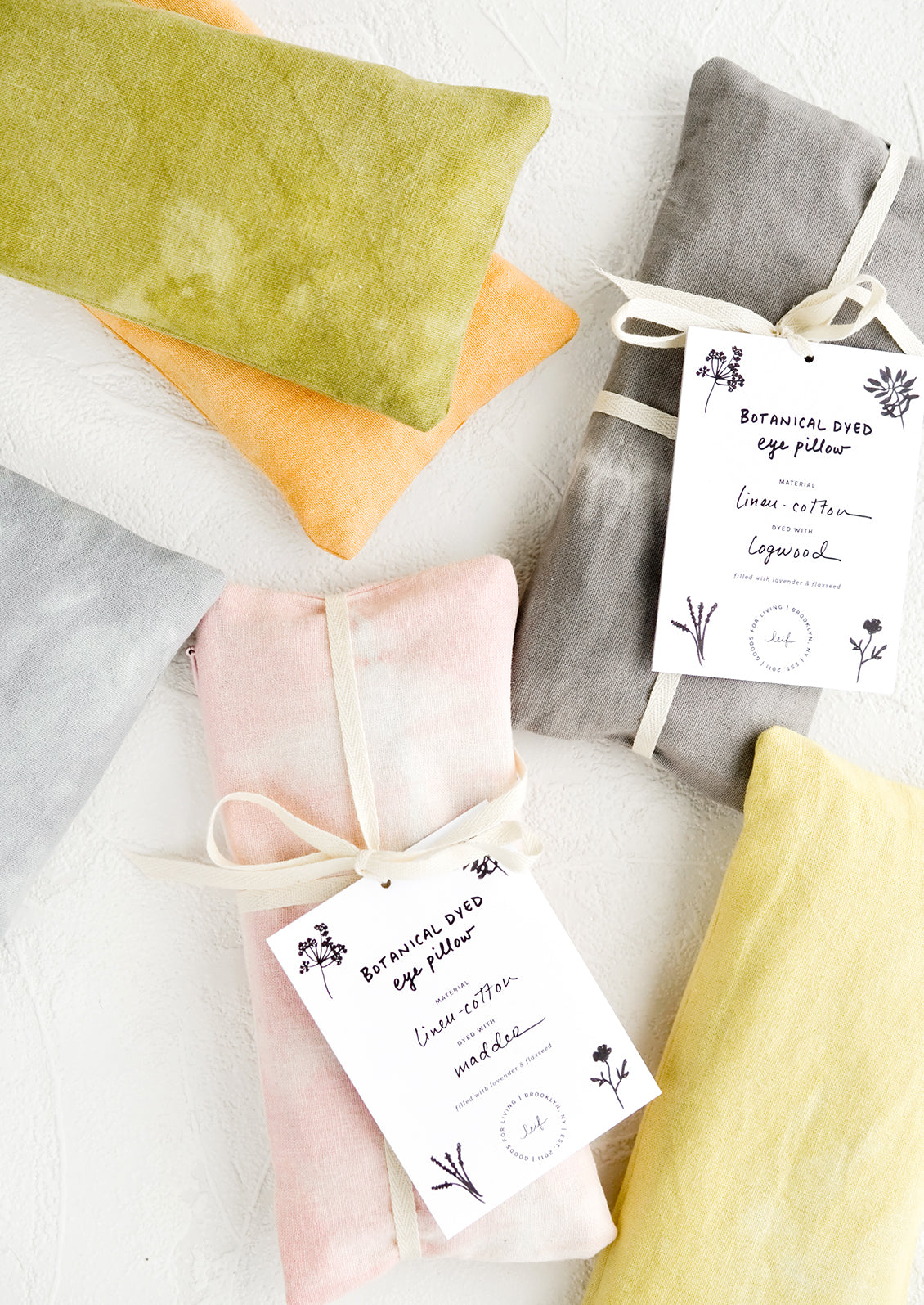 Rectangular eye pillows in naturally dyed fabrics and an assortment of colors.