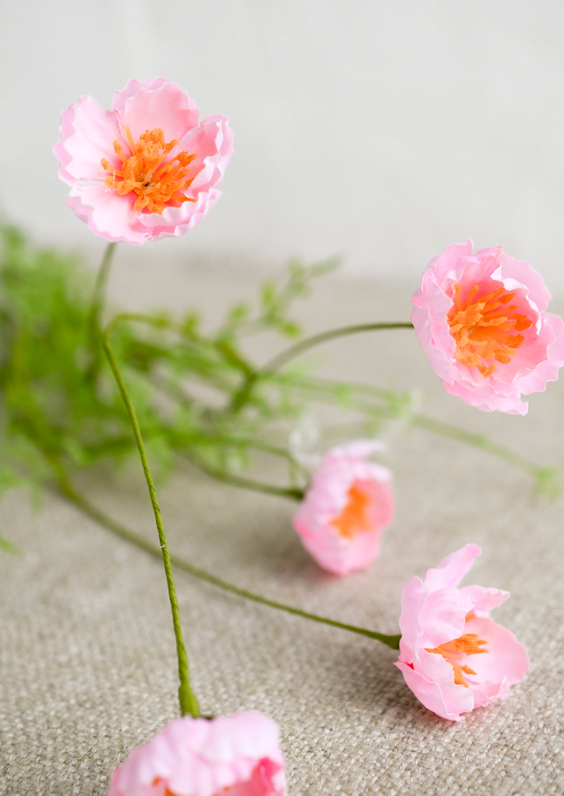 A faux mini poppy spray in pink.