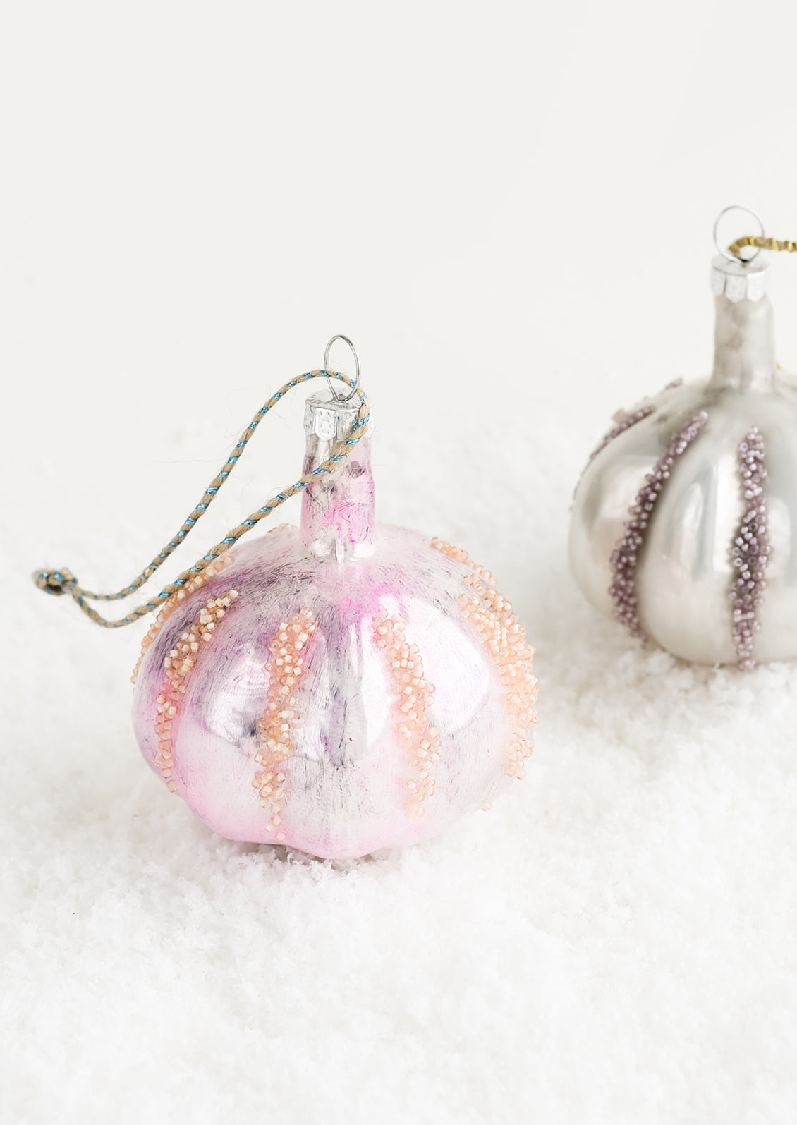 A decorative glass ornament in the shape of garlic bulb.