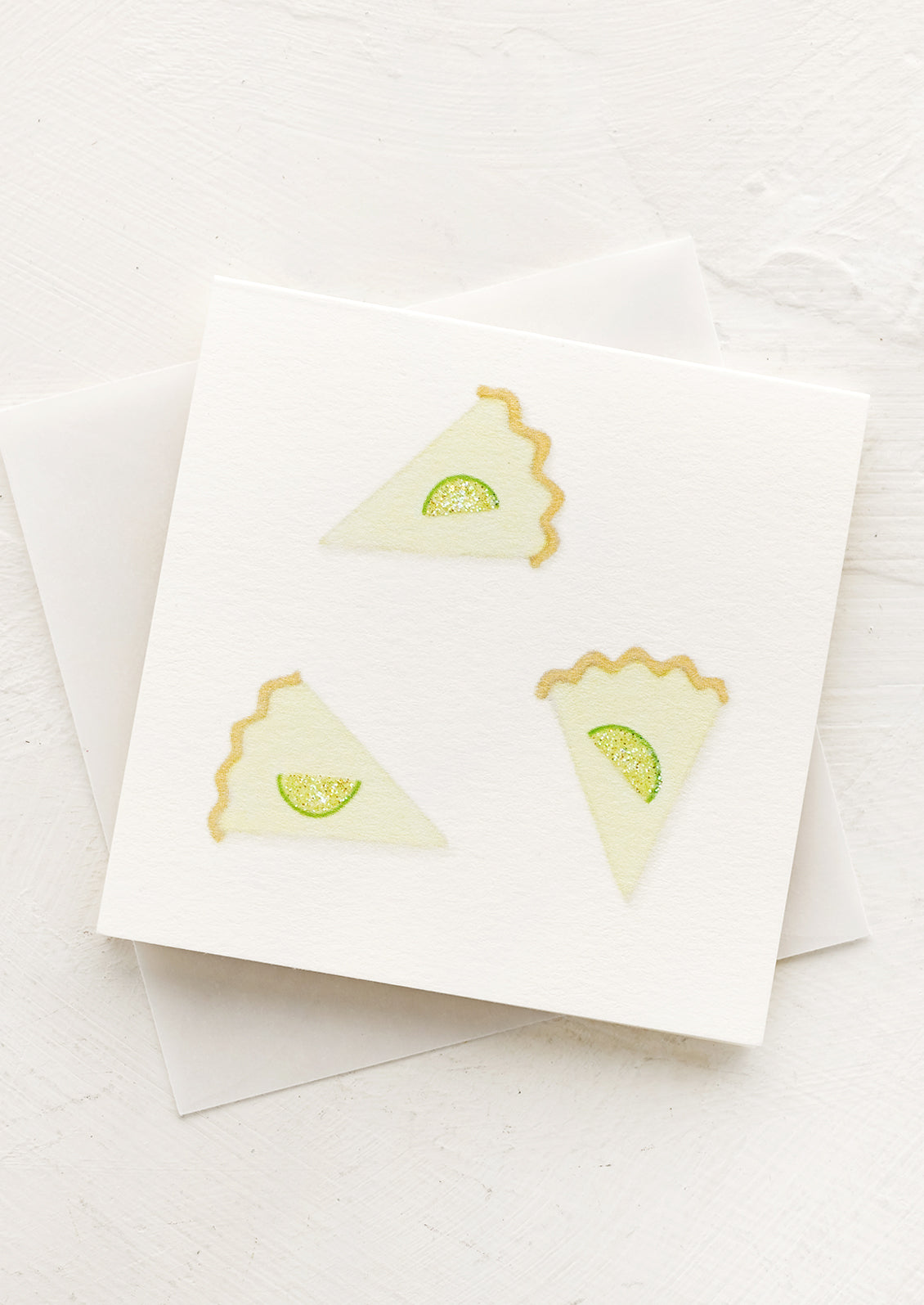 A small gift enclosure card with illustration of slices of key lime pie.