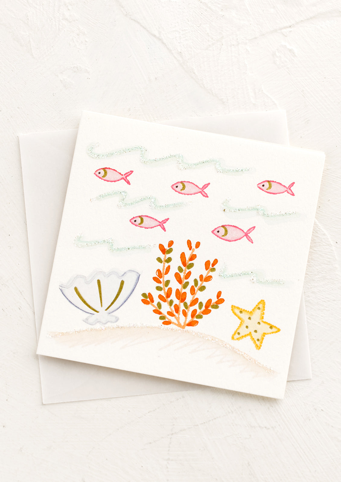 A small gift enclosure card with illustration of sea life scene.