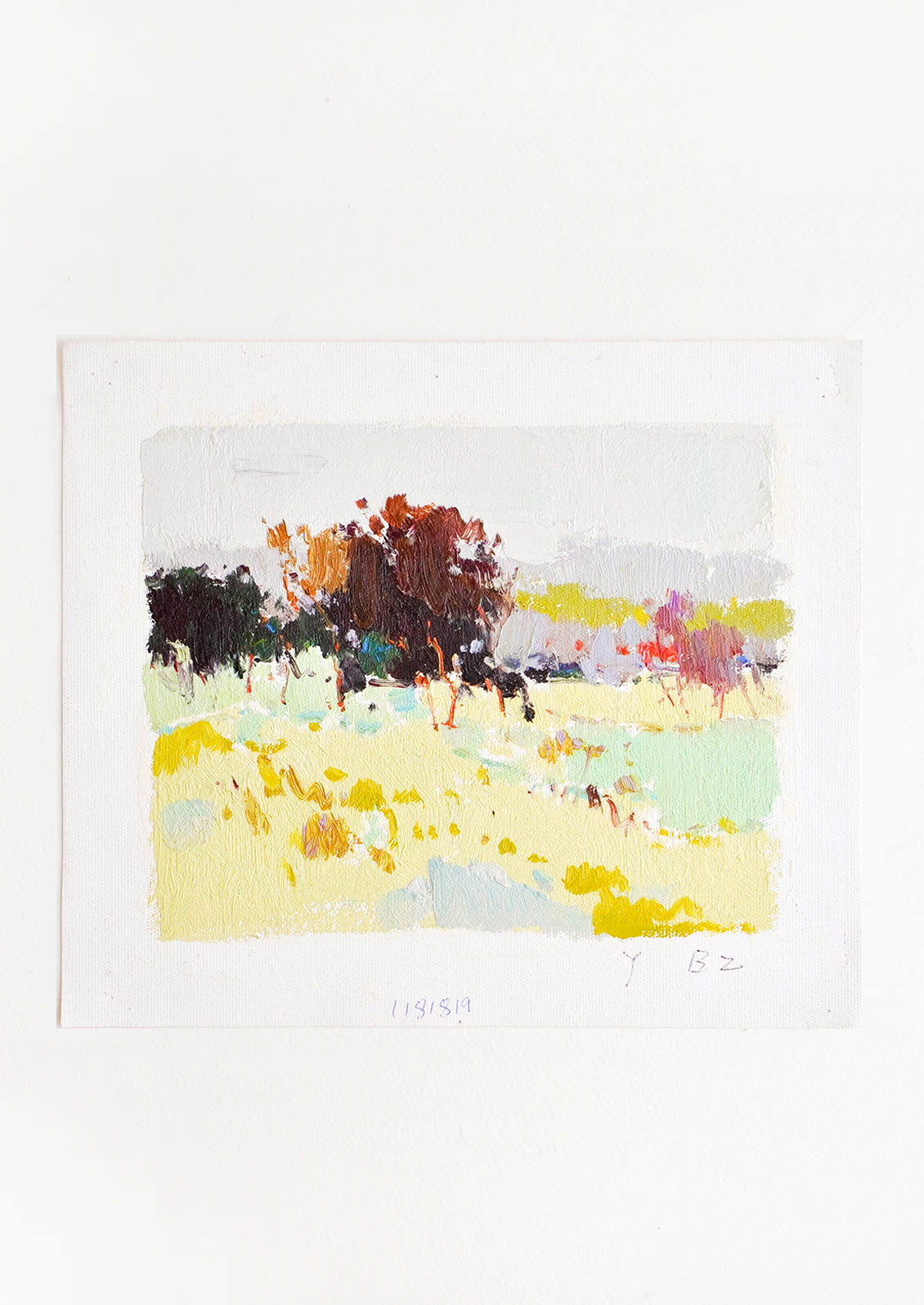 An impressionist landscape of yellow fields and maroon trees.