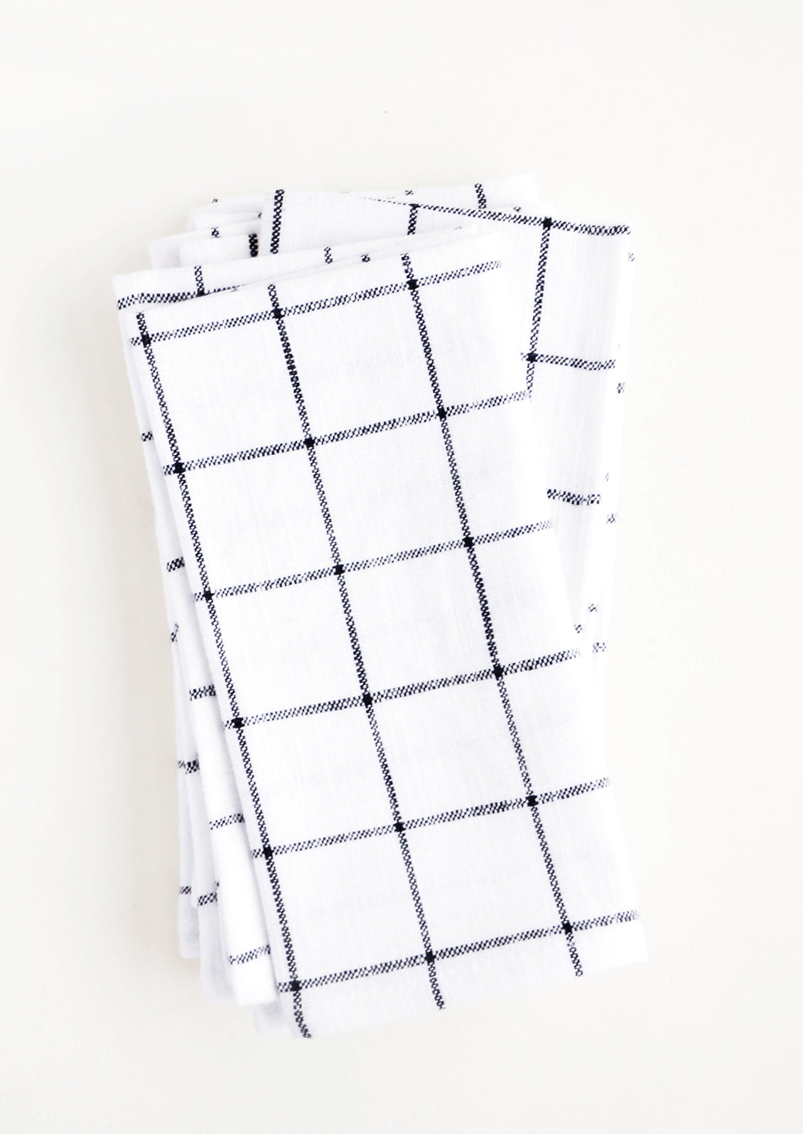 Pair of cloth cotton napkins in white with charcoal grid print