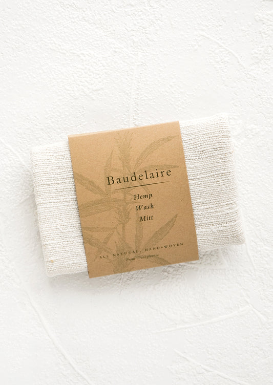 Folded natural hemp fabric packaged as a wash mitt intended for use in bathing