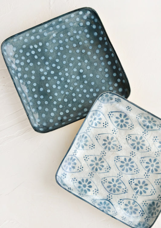 Square catchall trays in assorted indigo motifs.