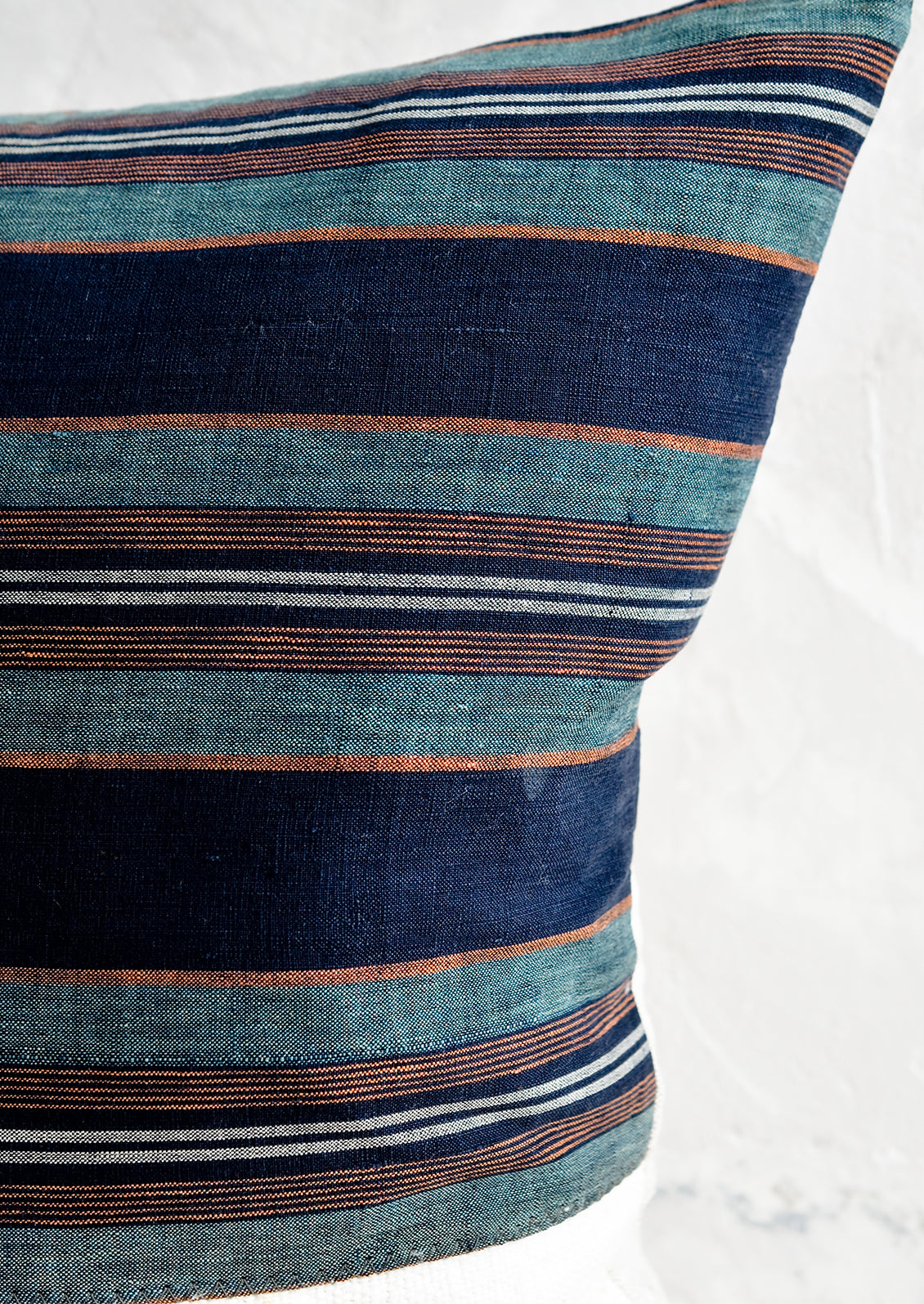 Striped japanese hemp fabric in indigo, teal, orange and white.