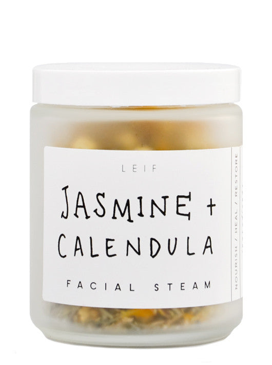 A frosted glass jar with a black and white label and white plastic lid.