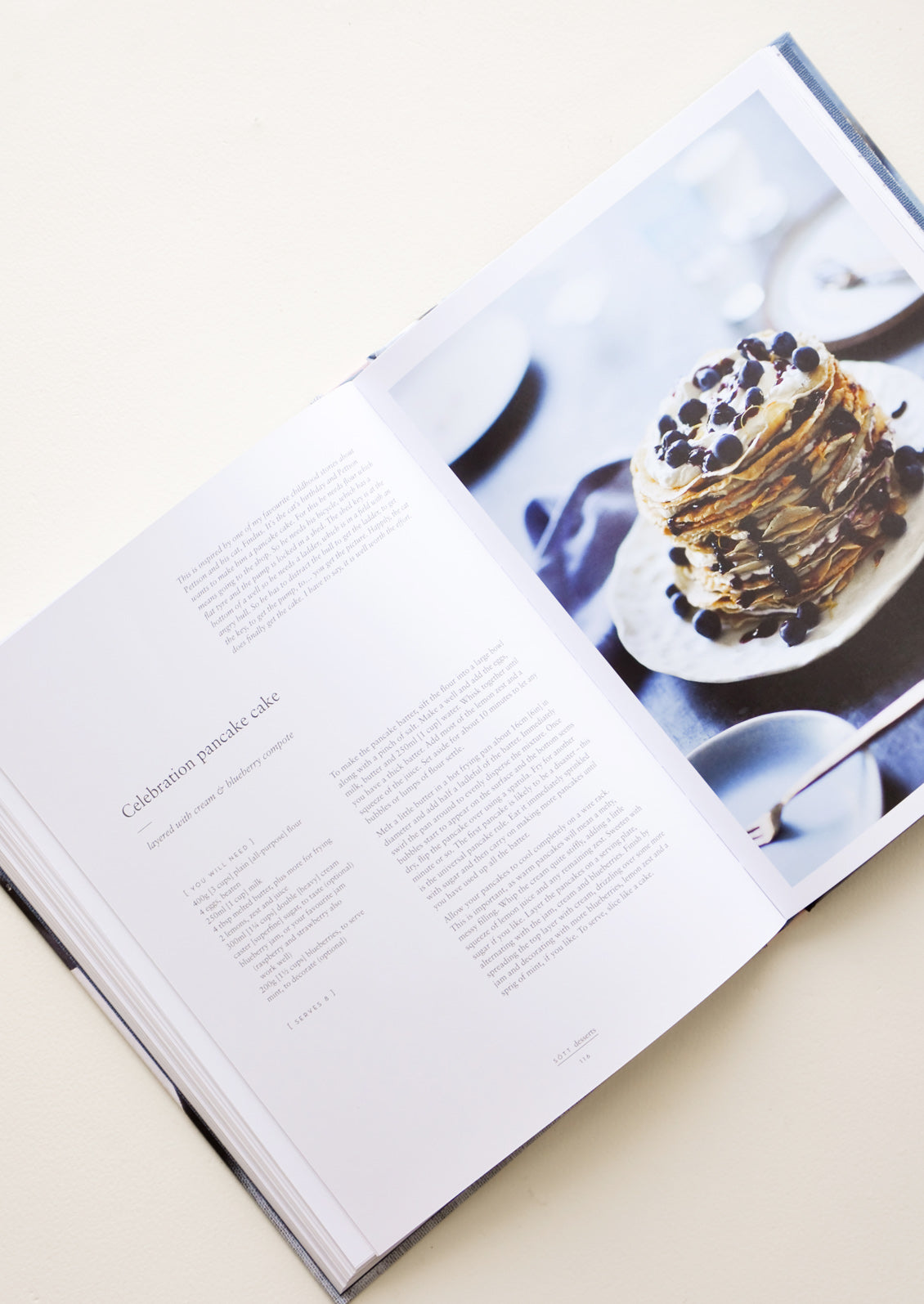 A cookbook opened to a recipe for pancakes.