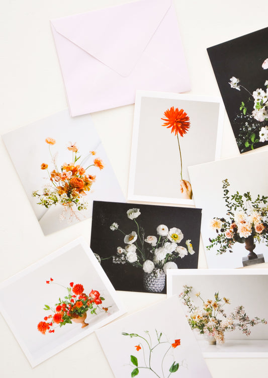 Product show showing multiple styles of floral photography notecards.