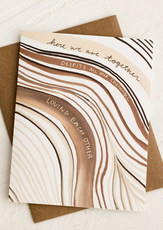 A card reading "Here we are together, despite all our challenges, loving each other".