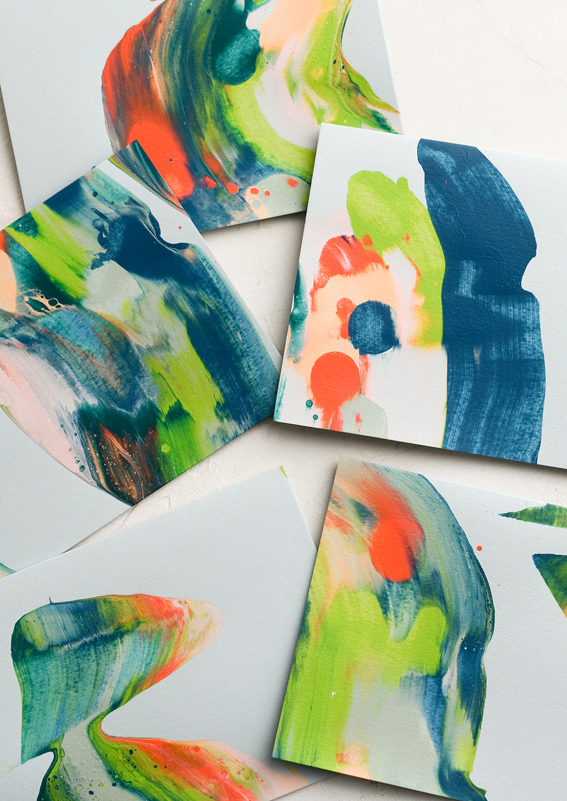 Paintswirl cards in shades of blue, coral and green.