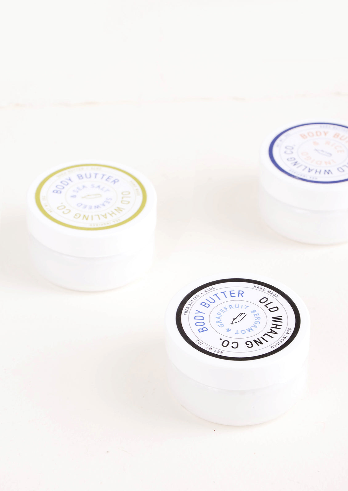 Round plastic jars of body/hand lotion
