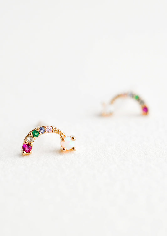 Rainbow shaped stud earrings with colored crystals and opal "cloud" at end