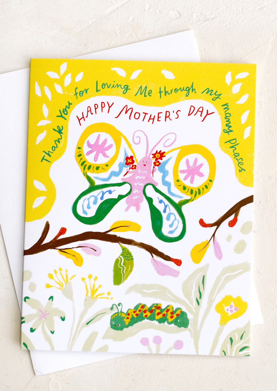 A greeting card reading Thanks for loving me through all my many phases.