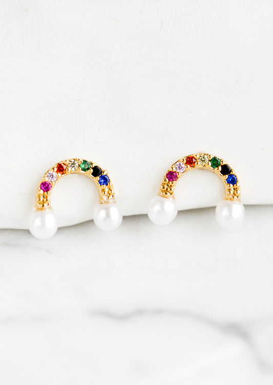 A pair of stud earrings in multicolor rainbow arc with pearl "clouds".