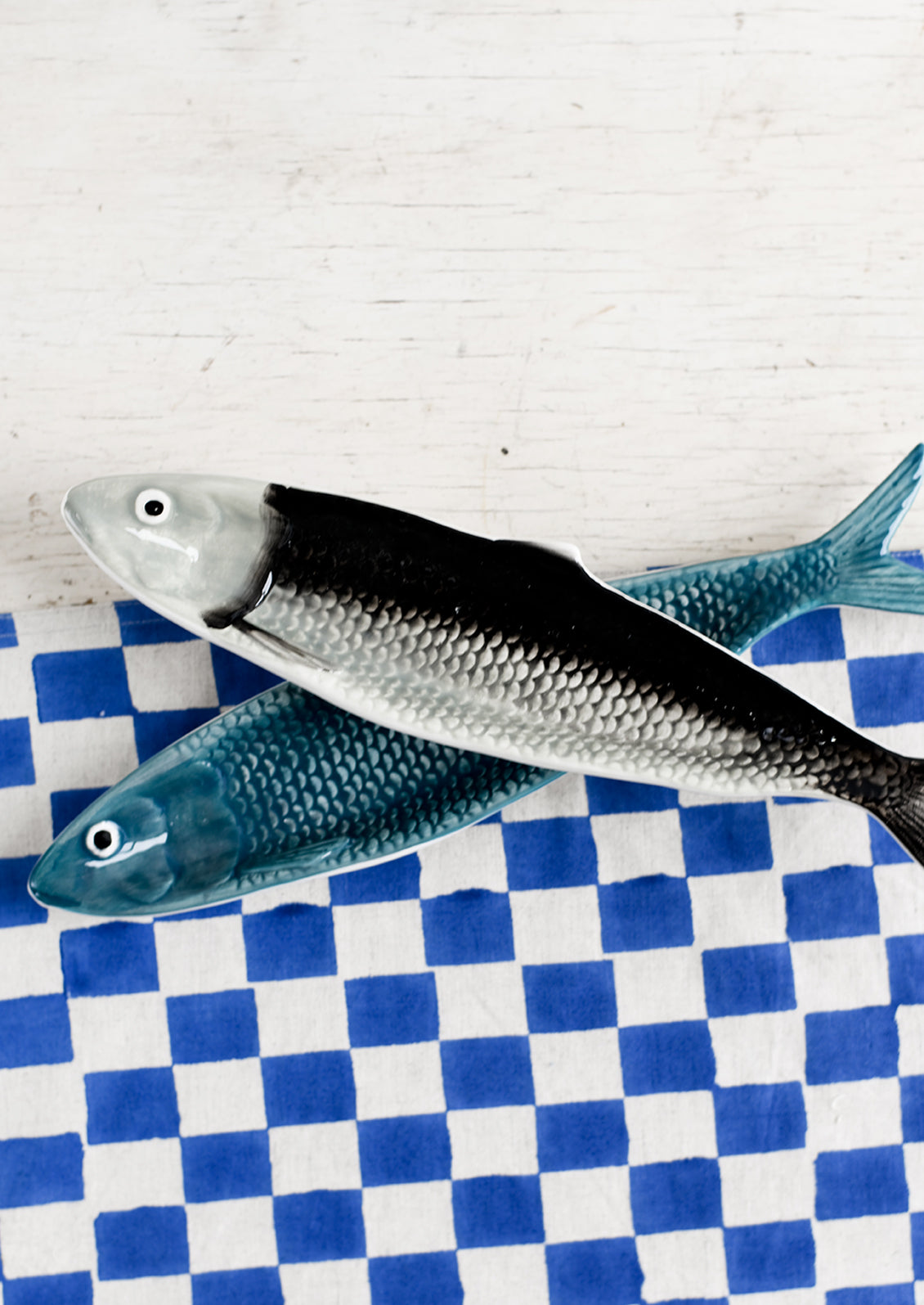 Ceramic trays in the shape of sardines.