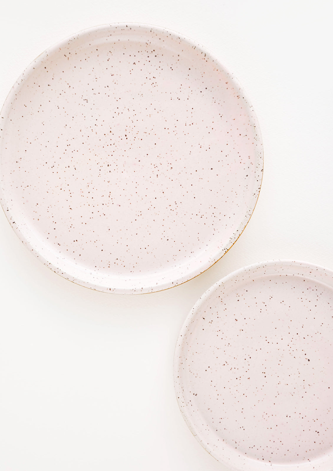 A pair of Pale Pink Colored Speckled Ceramic Salad & Dinner Plates.