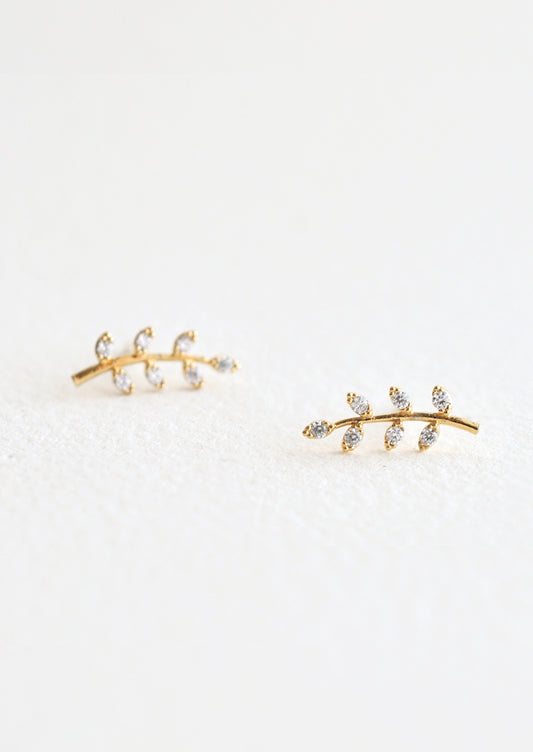 Gold stud earrings in leaf/sprig design with cubic zirconia "leaves".