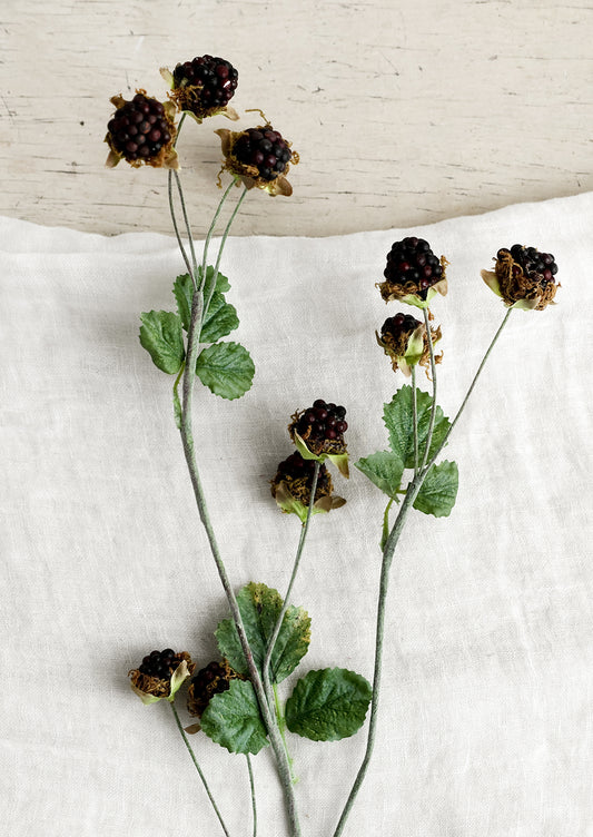 A decorative faux blackberry spray.