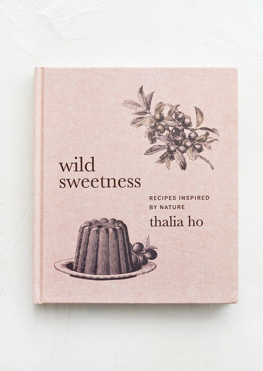 A cookbook with pink bookcloth cover.