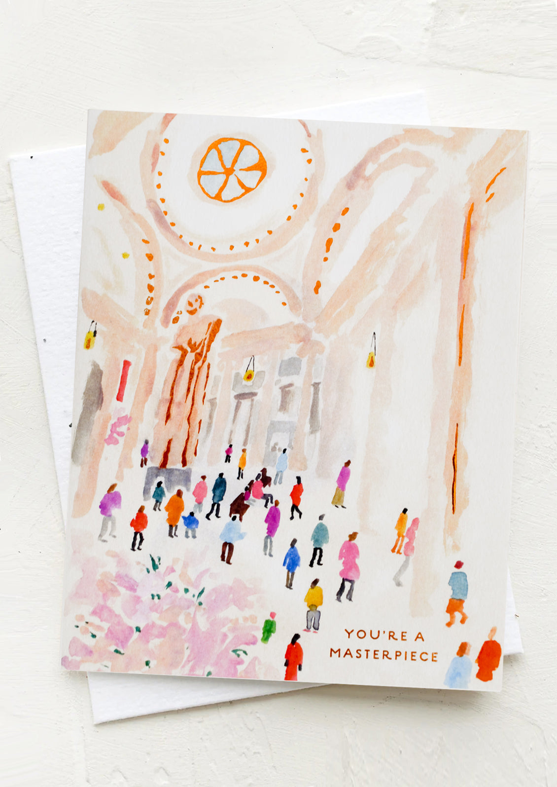 A greeting card with illustration of people in a museum, text reads "You're A Masterpiece".