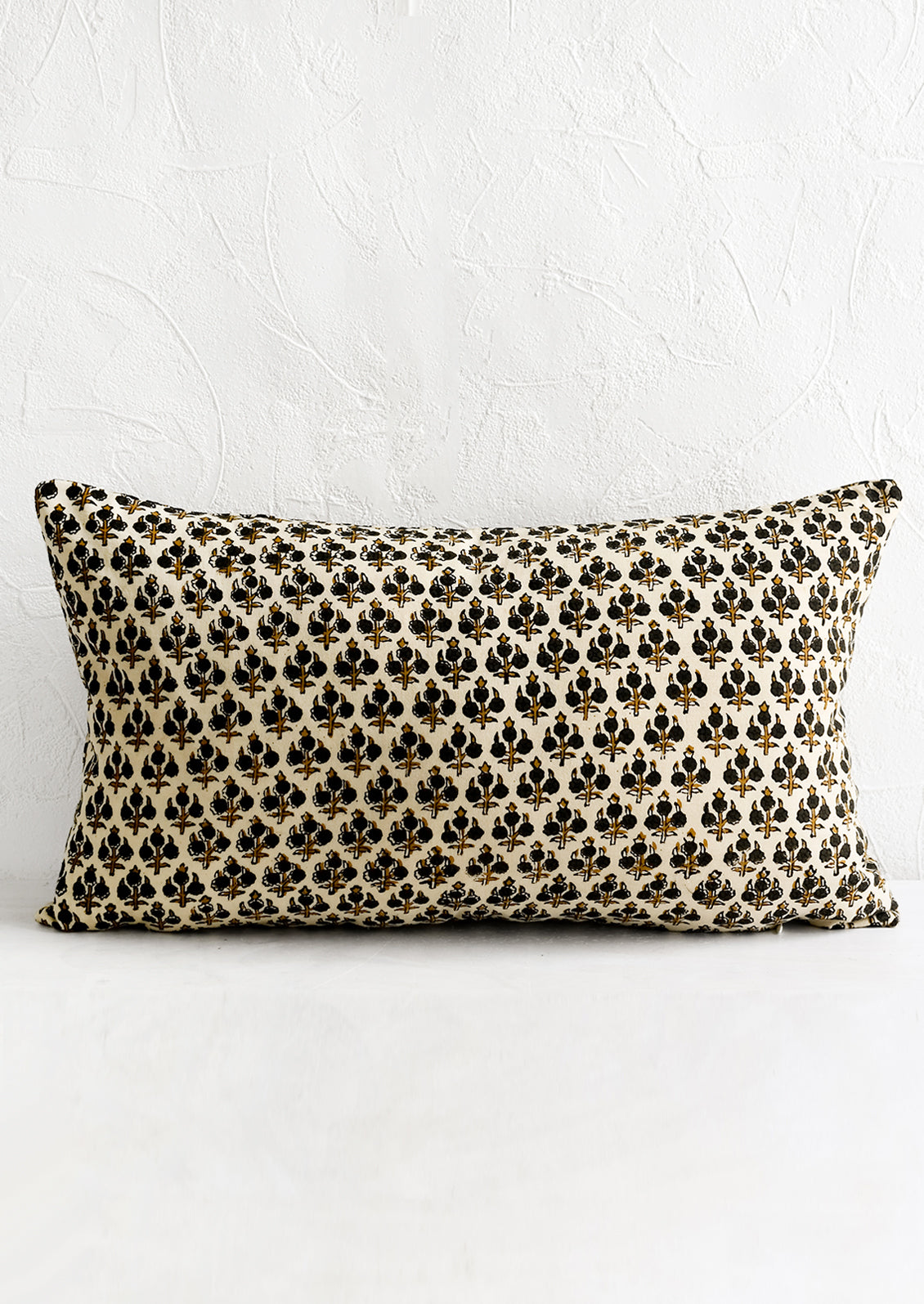 A block printed lumbar pillow.